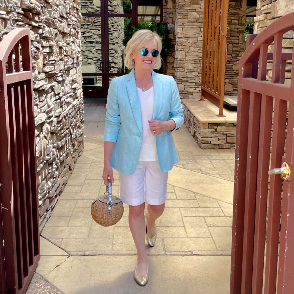 over 50 fashion blogger jennifer connolly wearing linen blazer and white shorts