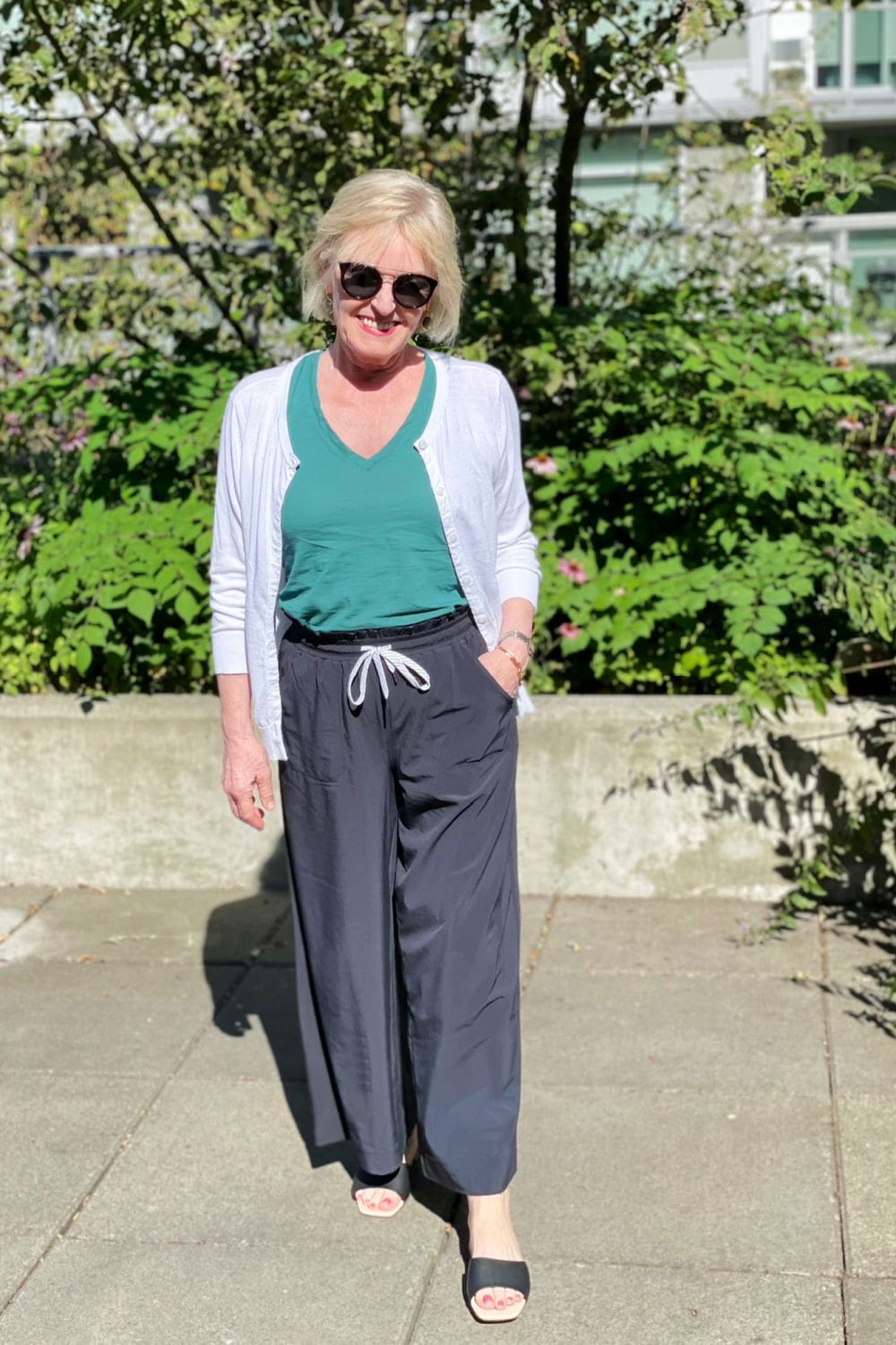 over 50 blogger showing how to dress up athletic pants