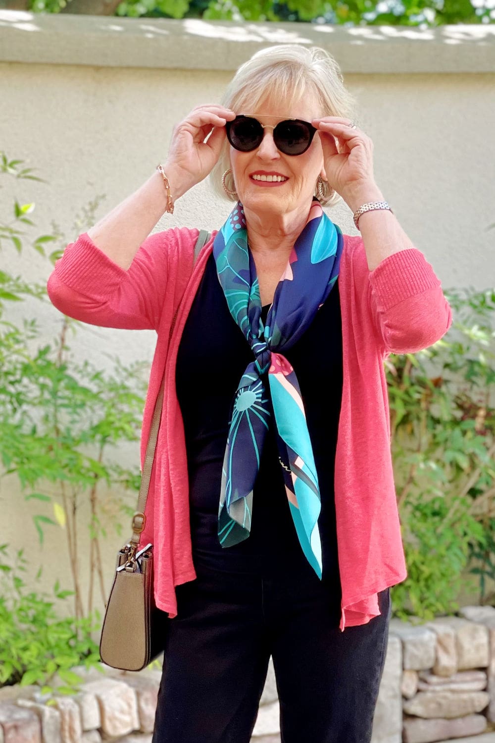 over 50 fashion blogger showing how to wear a scarf now and wear it later