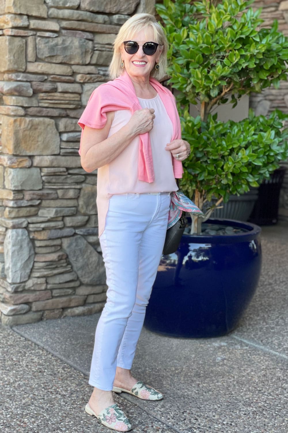 over 50 blonde blogger showing how to do a half tuck