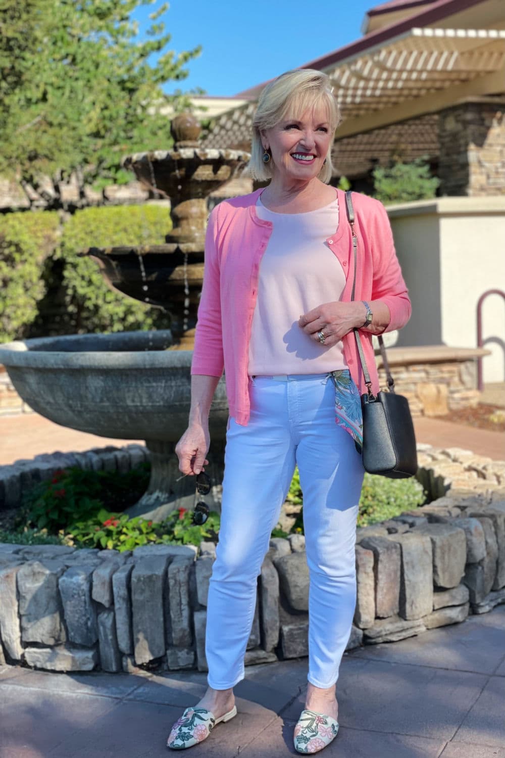 over 50 fashion blogger jennifer connolly of a well styled life wearign talboys pink cardigan with chicos white jeans
