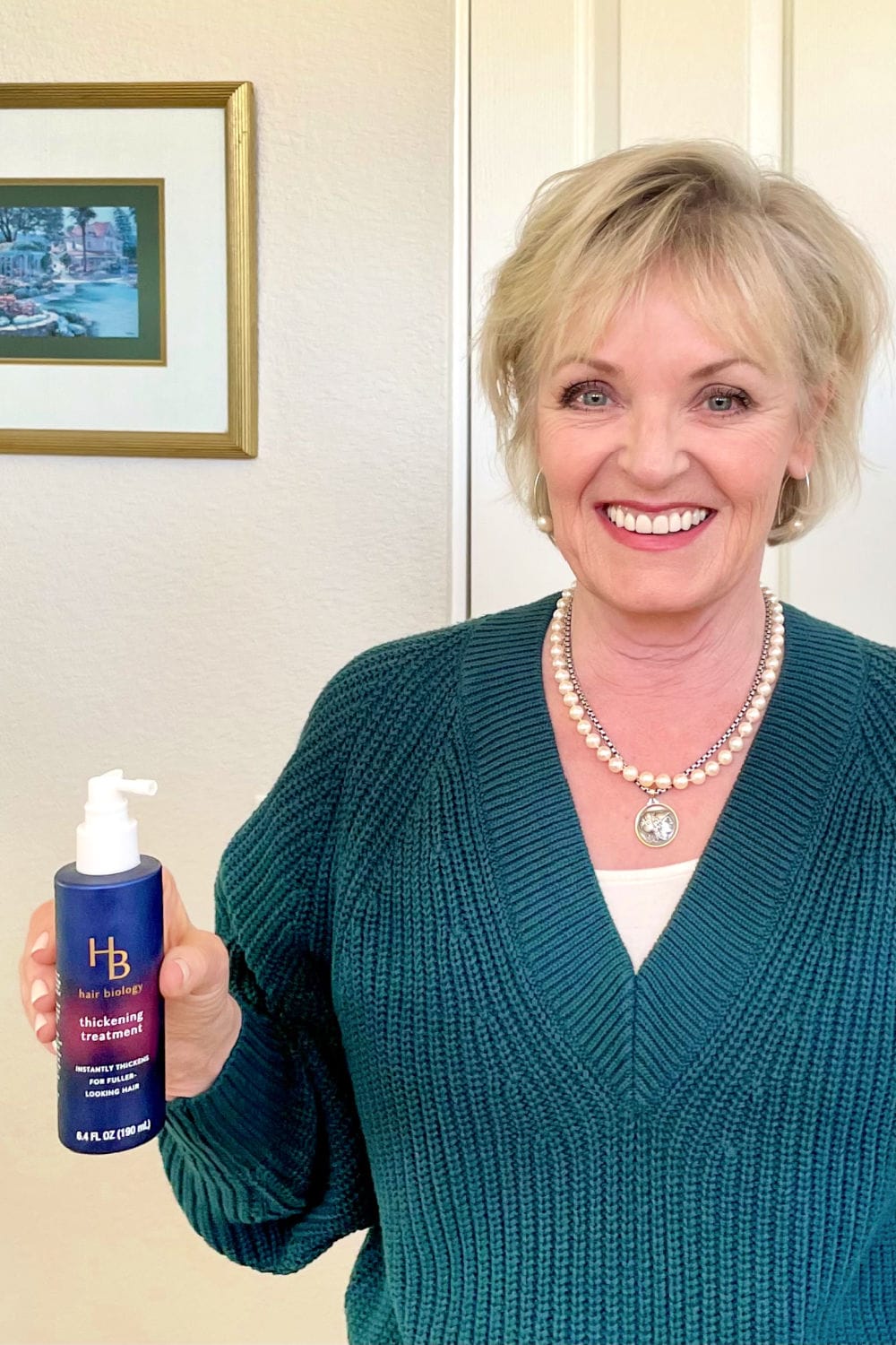 jennifer connolly of a well styled life holding hair biology thickening spray