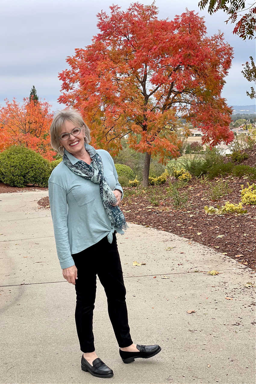 woman wearing black faux suede leggings and black loafers