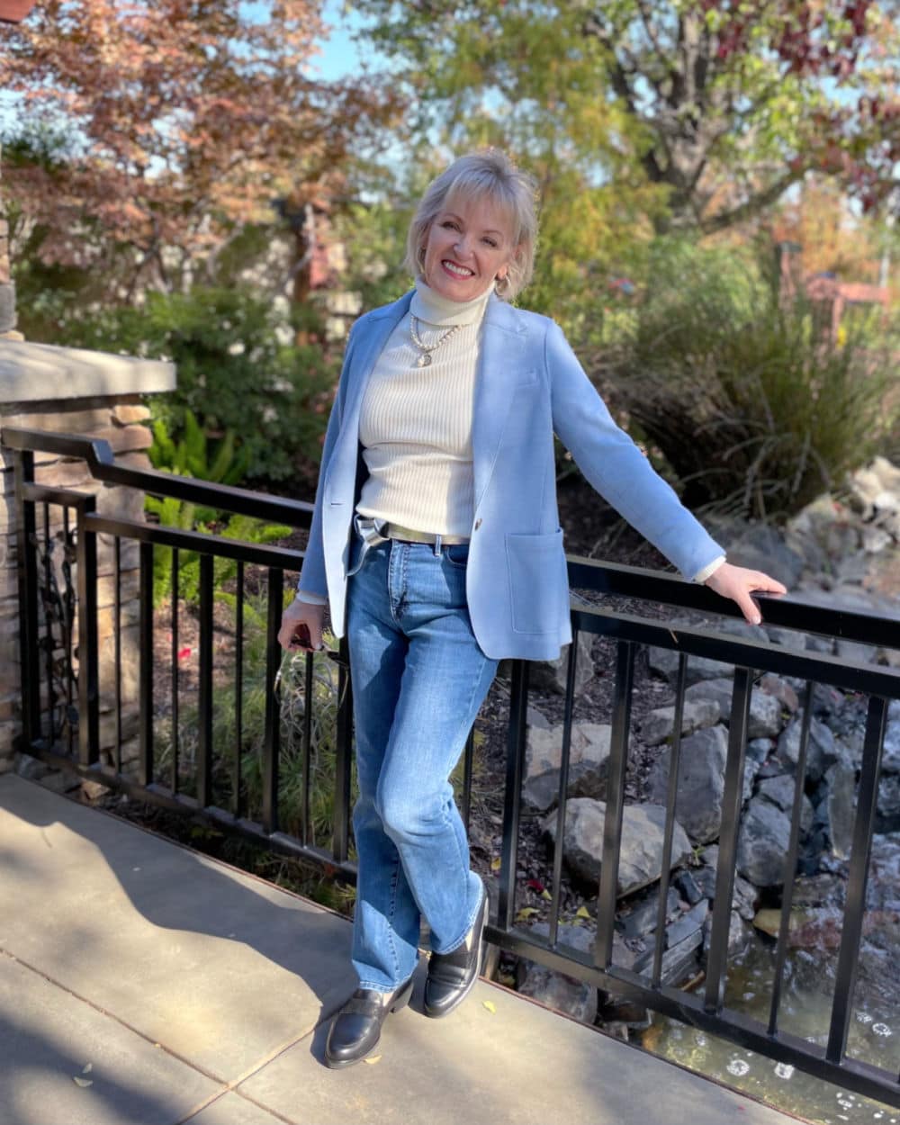 Jennifer of A Well Styled Life wearing unstructured knit blazer with blue jeans