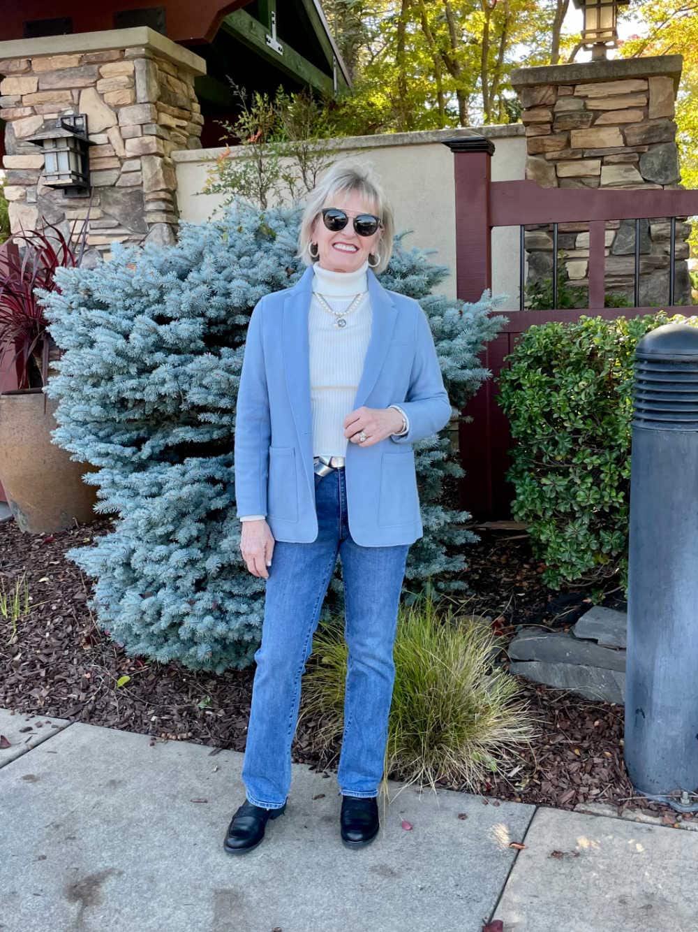 blond woman wearing blue KNIT blazer with jeans and loafers