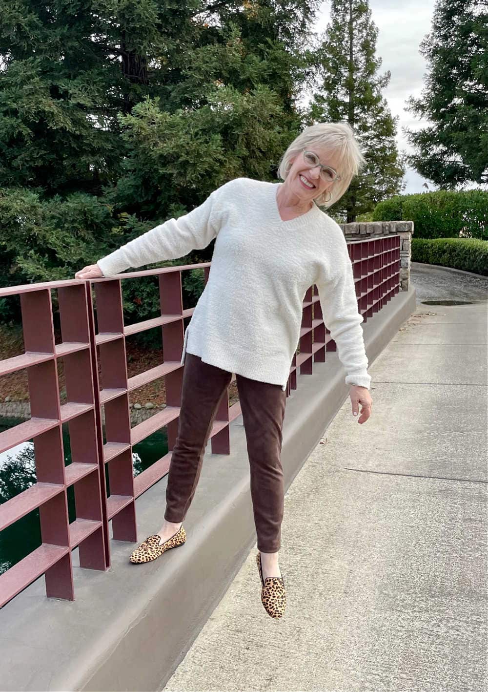 woman wearing faux suede leggings and teddy sweater