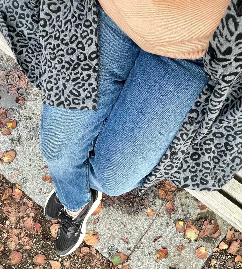 gray leopard jacket and camel sweater outfit