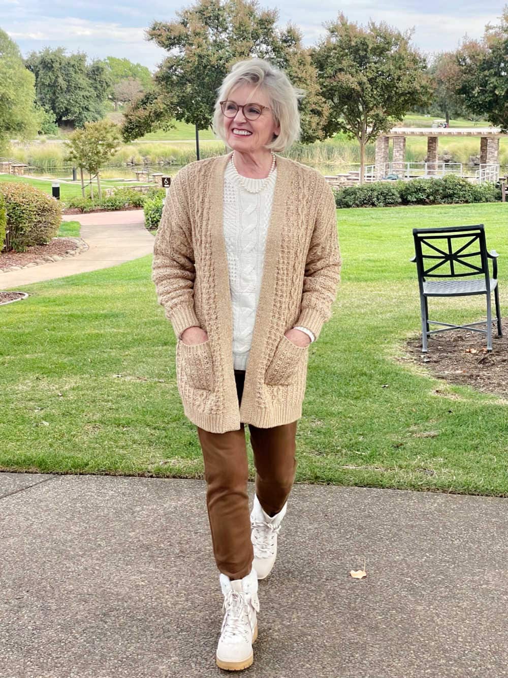 woman wearing neutral outfit with interesting texture