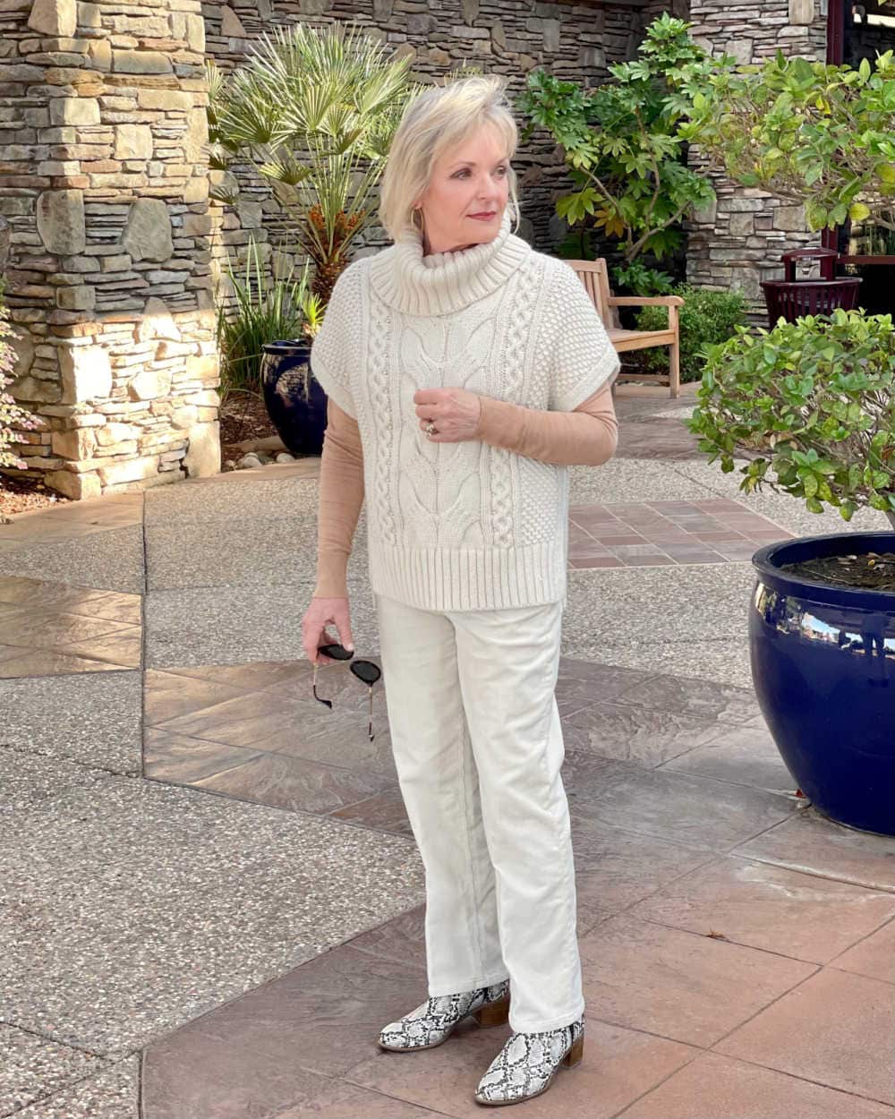 woman wearing beige vest and beige pants