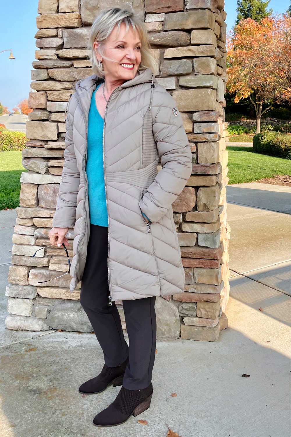 woman wearing beige coat and eileen fisher booties