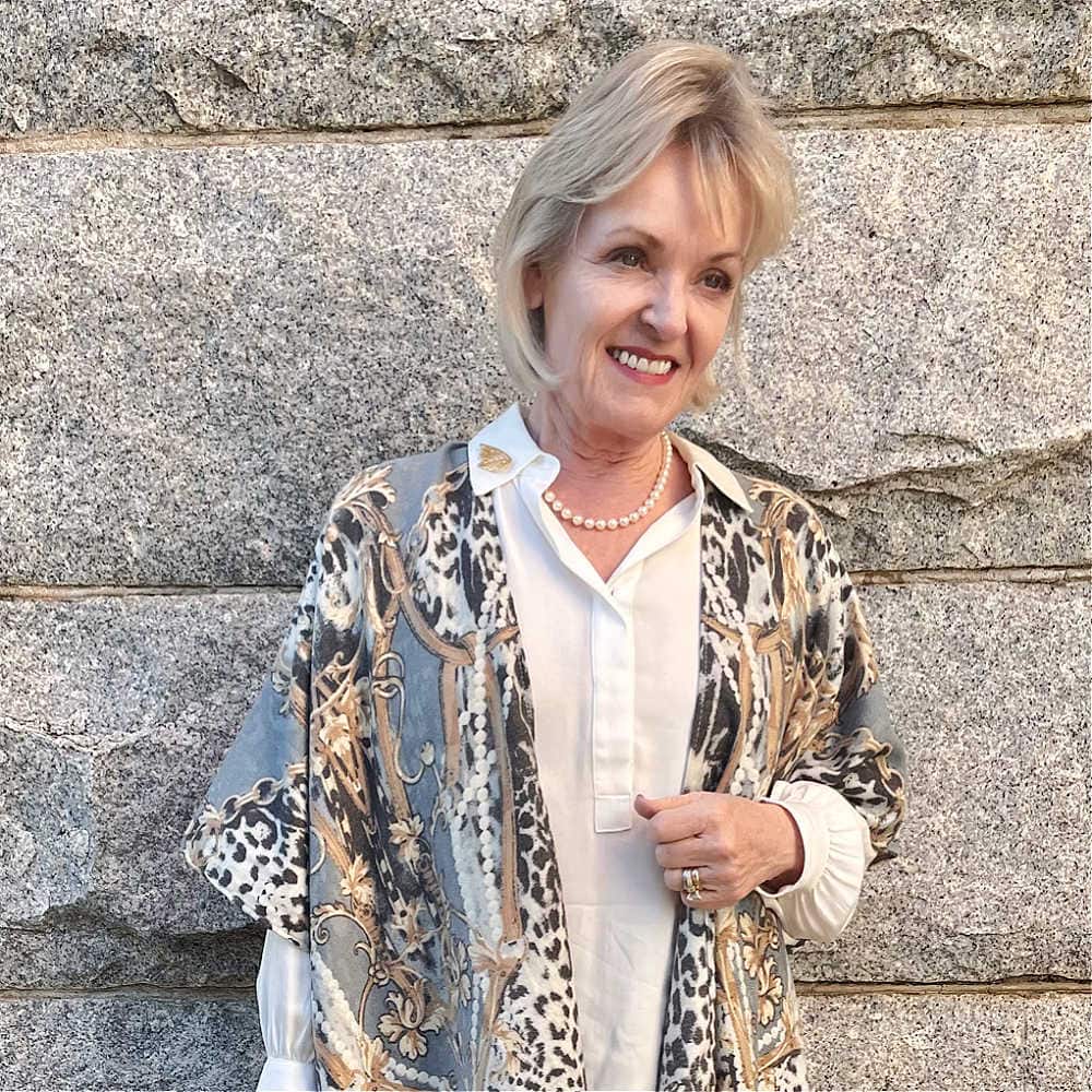 woman wearing dean davidson filiole brooch