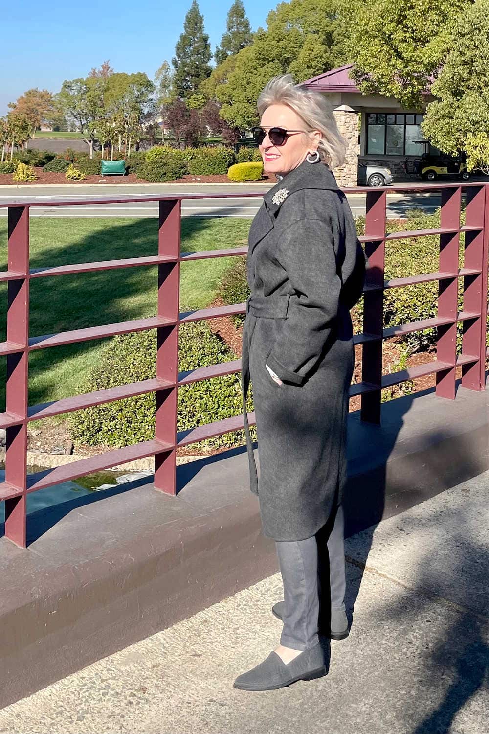 woman wearing long gray coat from nordstrom
