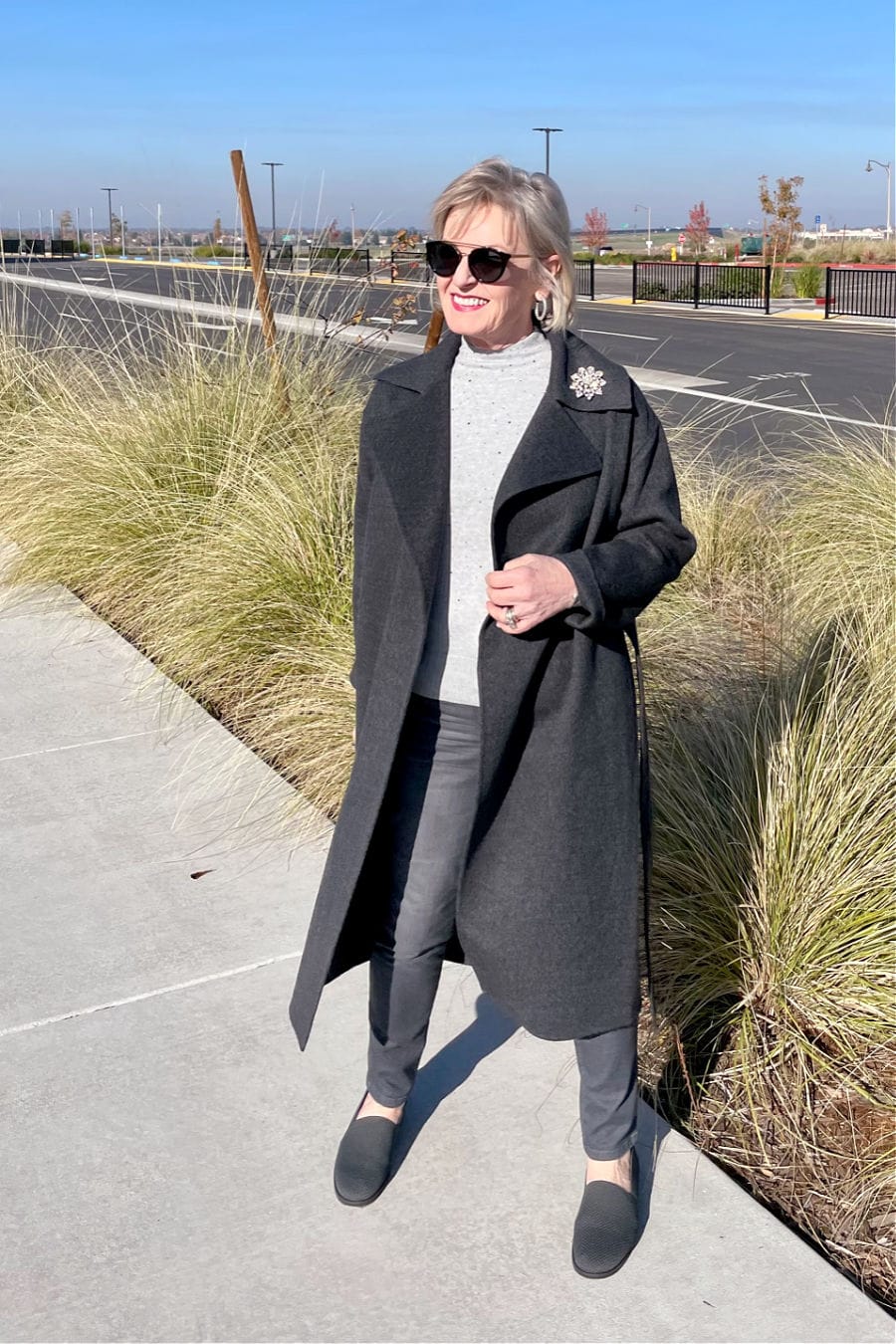 woman wearing all gray outfit with low contrast