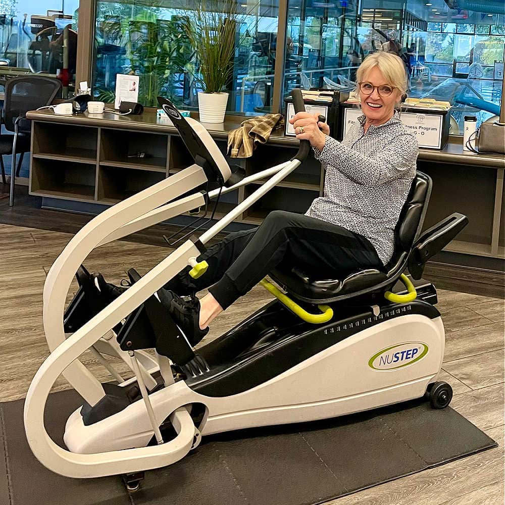 woman using nu step machne at gym