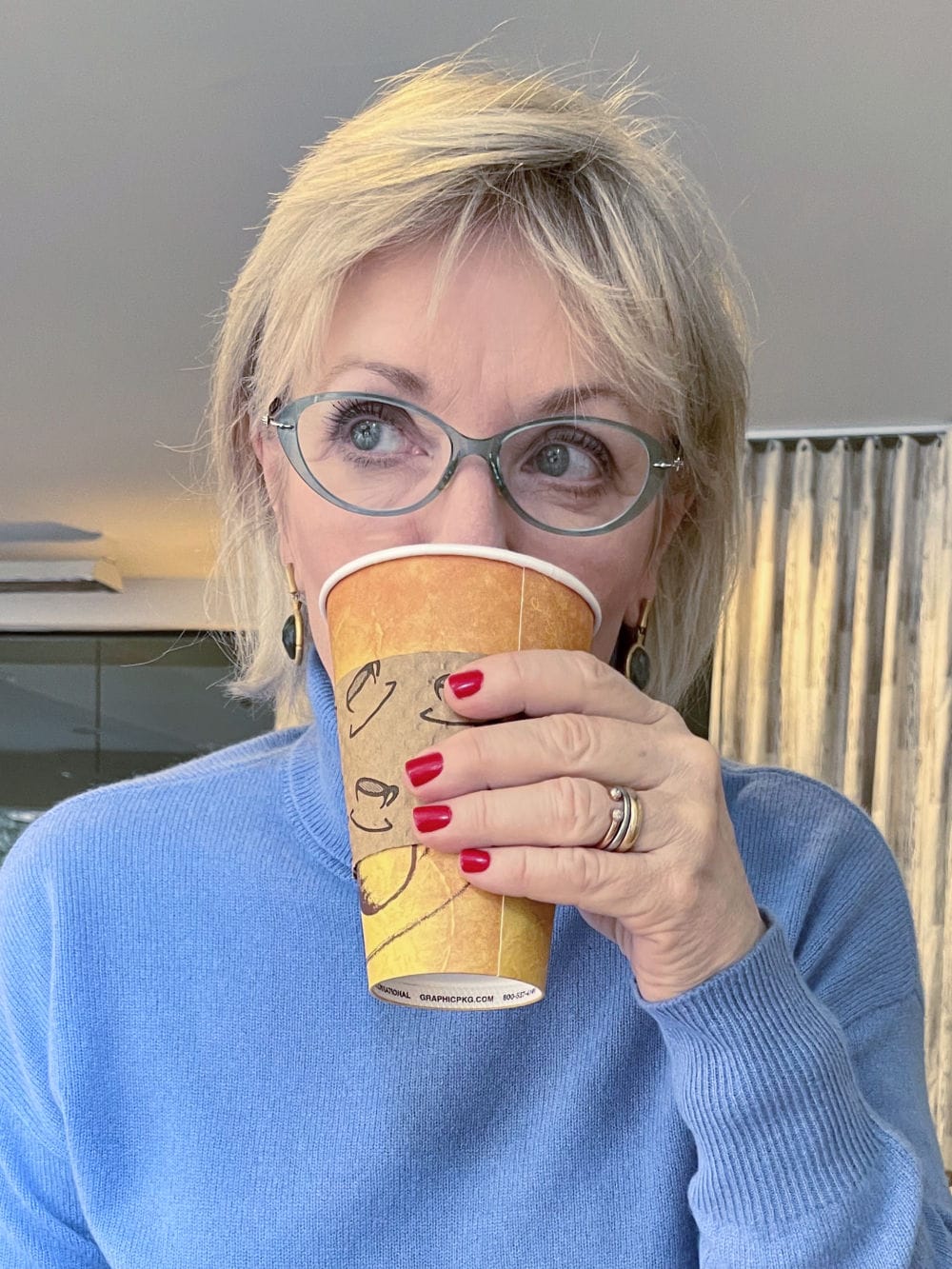 woman drinking tea with collagen powder in it
