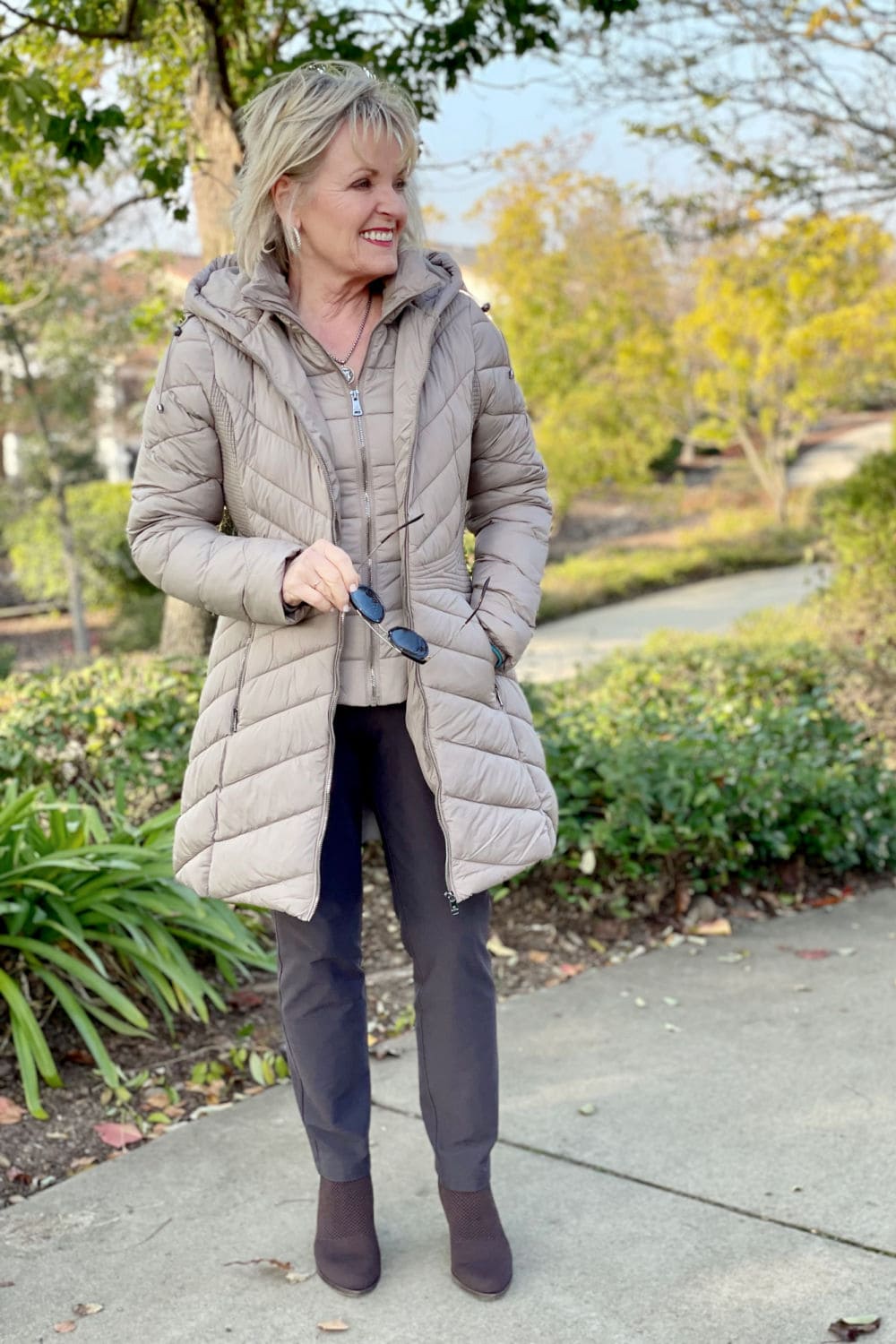 woman wearing sustainable puffer coat