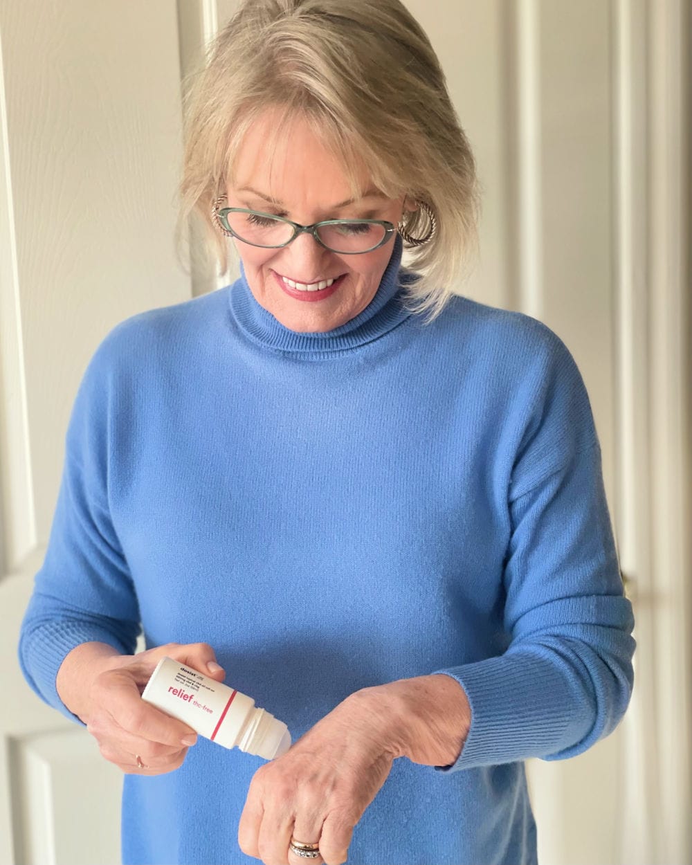 rolling dosist relief roll-on over arthritic knuckles