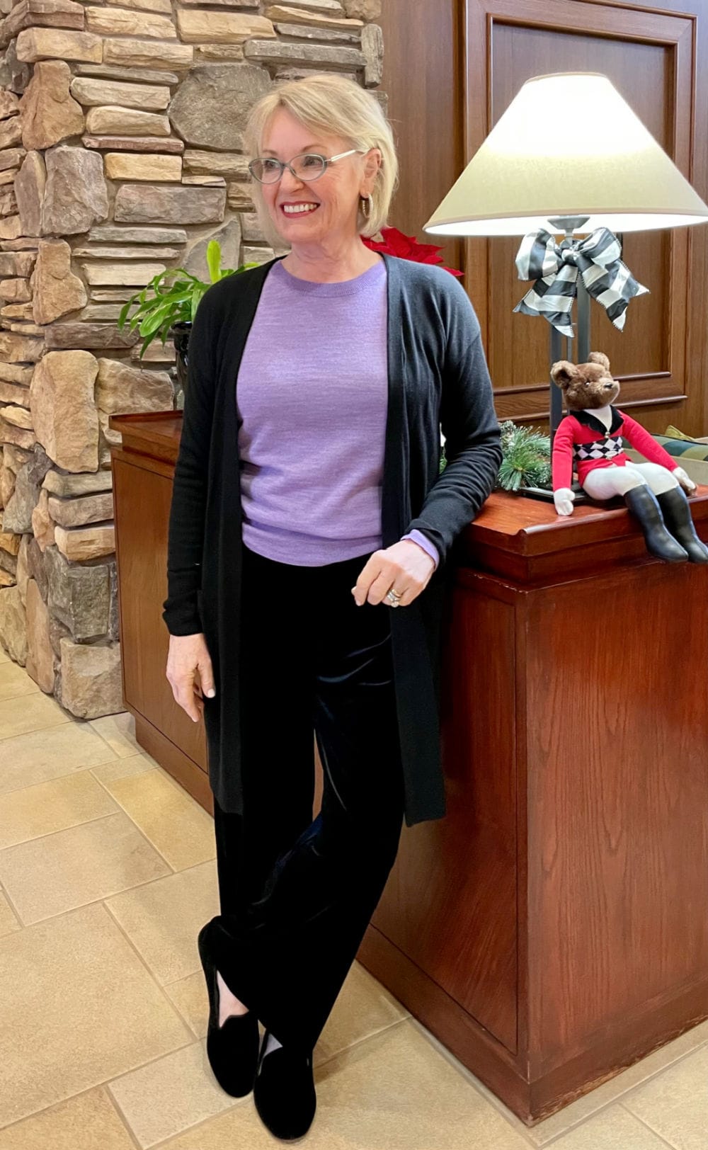 woman wearing velour pants and sweater casual festive outfit
