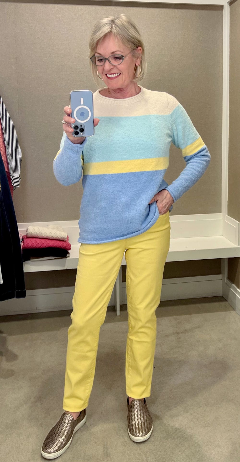 woman wearing yellow jeand and blue sweater from talbots