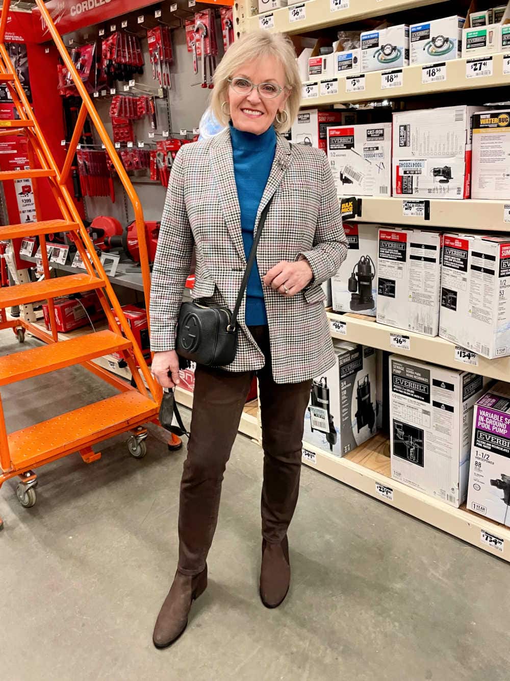 wokman in home depot wearing blazer and brown jeans