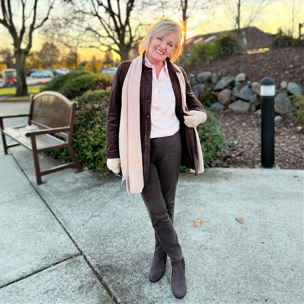 woman weaing faux suede jacket and silky shirt combining texture