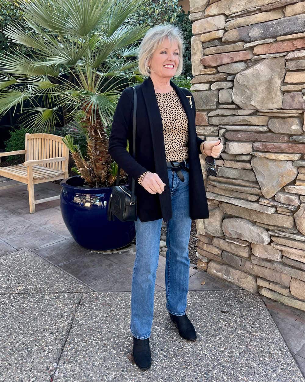 elevated casual outfit of sweater blazer and jeans