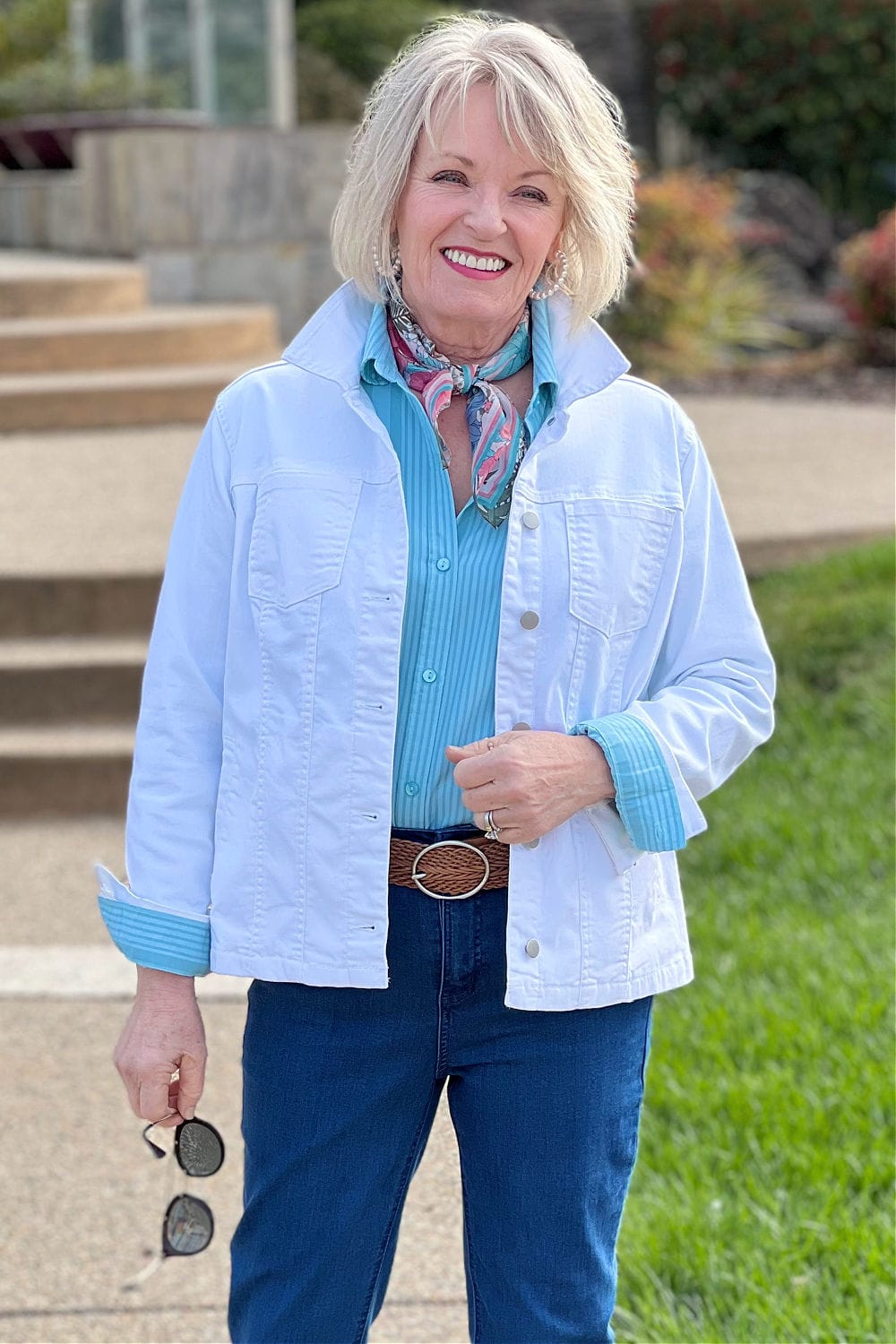 woman wearing white denim jacket
