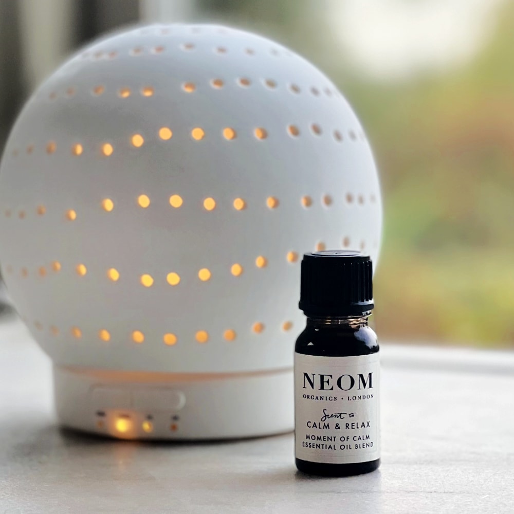 diffusing neom oil to balance and restore well-being