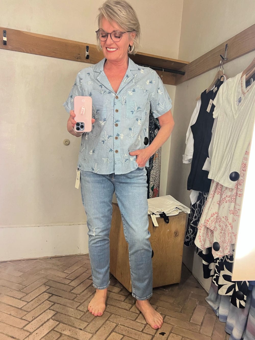 women wearing anthropologie shirt and jeans