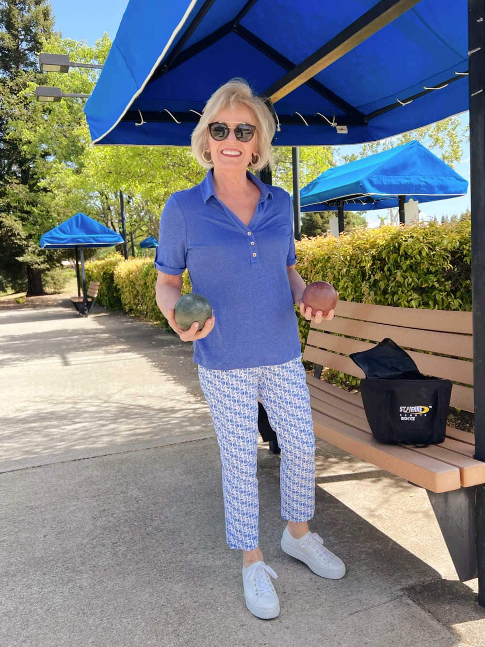 woman holding bocce balls