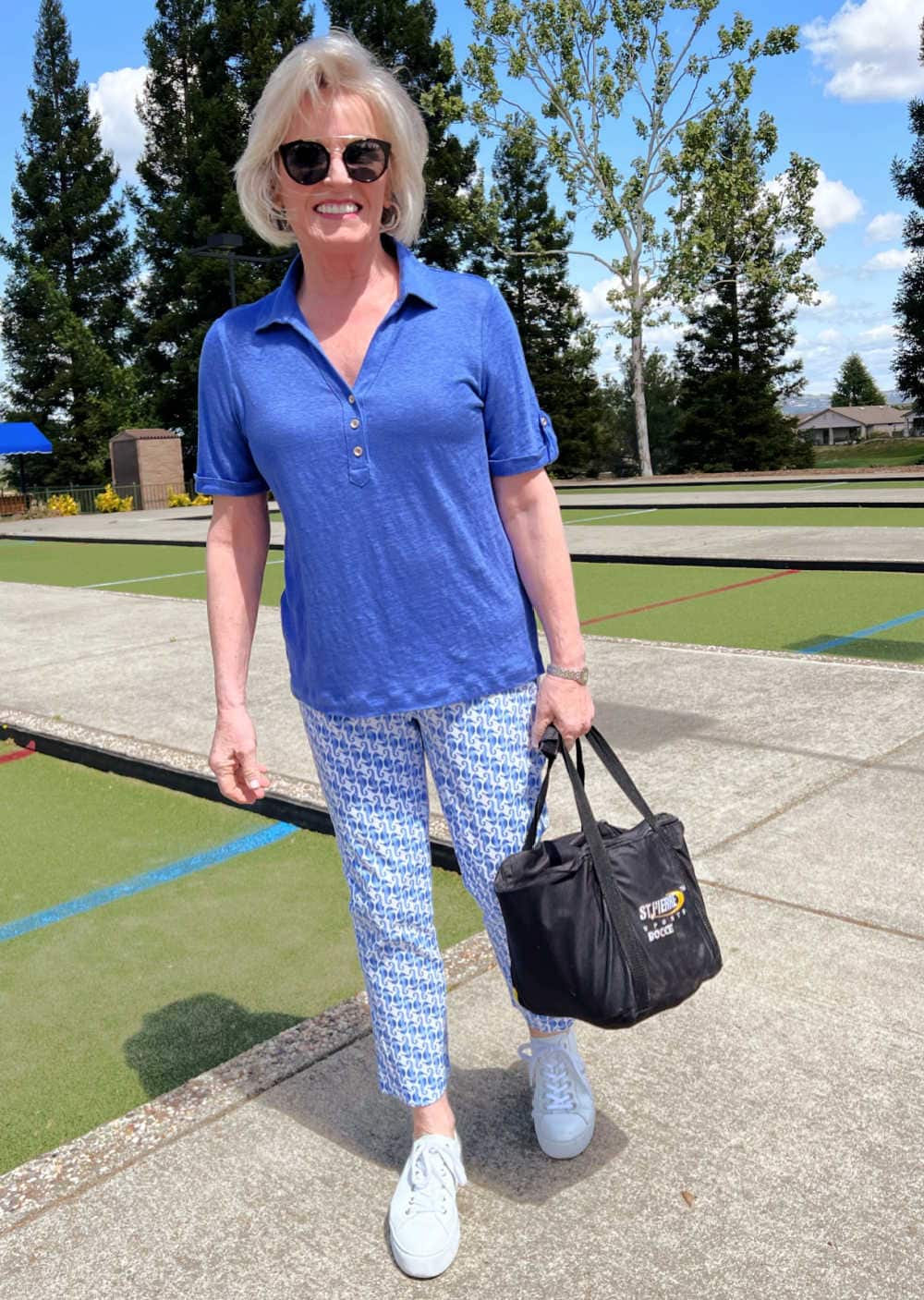 woman carrying bocce balls