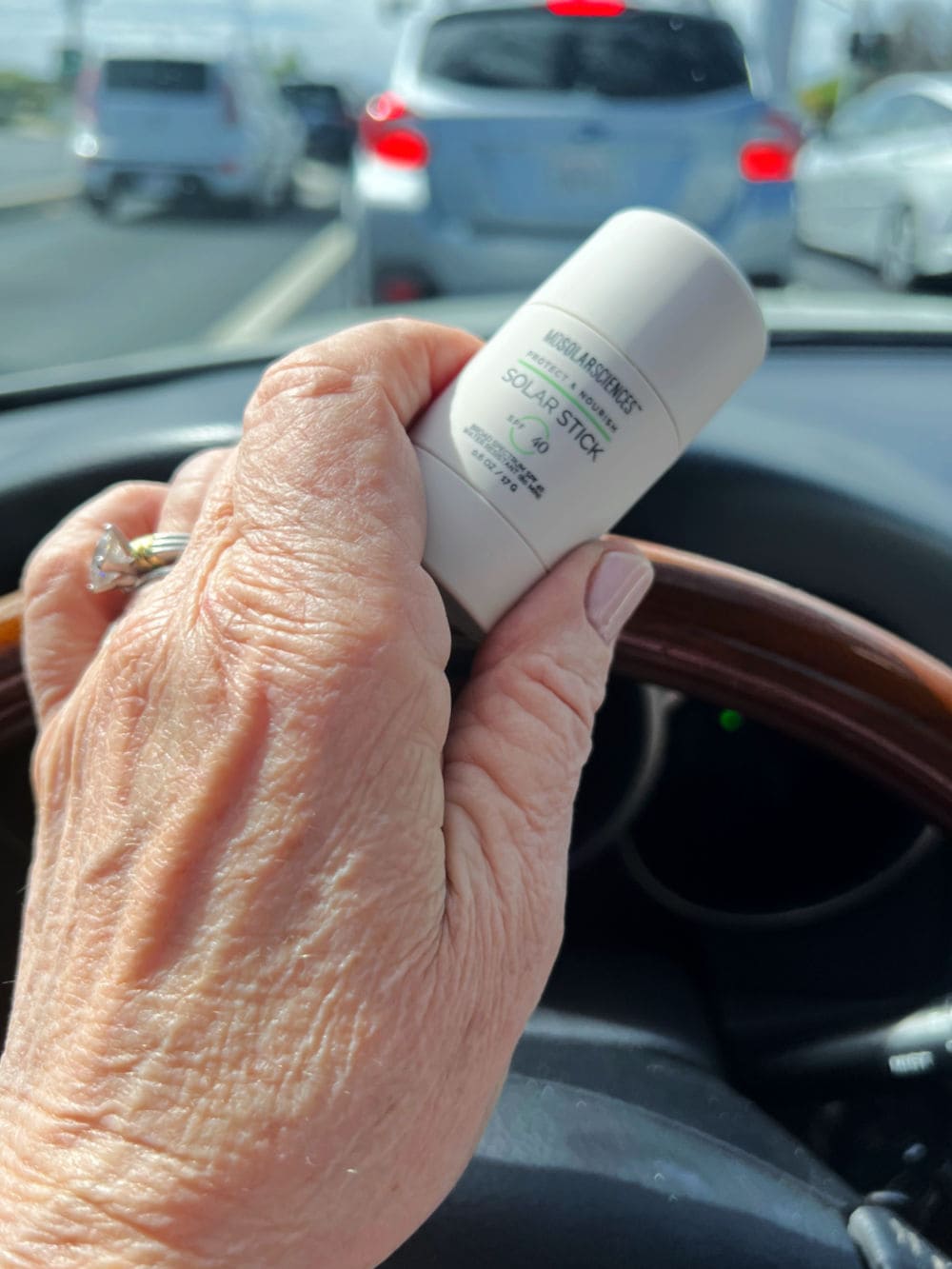 hand on steering wheel