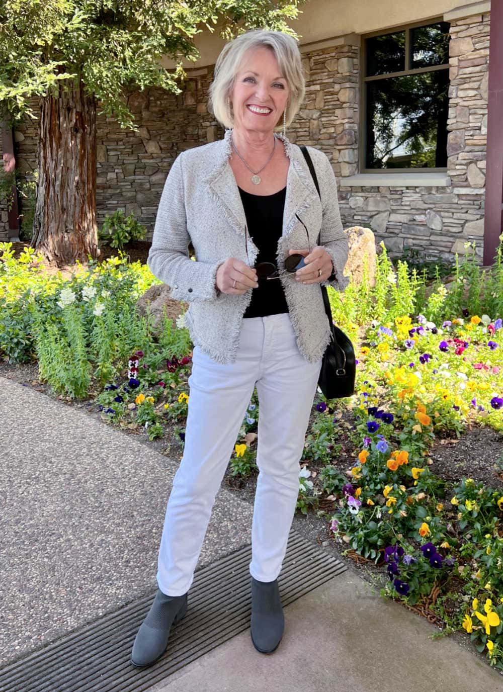 woman wearing timeless wardrobe essential blazer