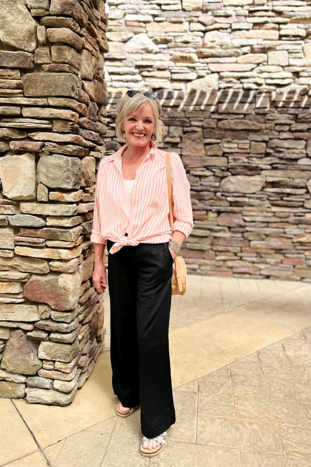 WOMAN STYLING MAD LOVE SANDALS WITH WIDE LEG PANTS AND STRIPED SHIRT
