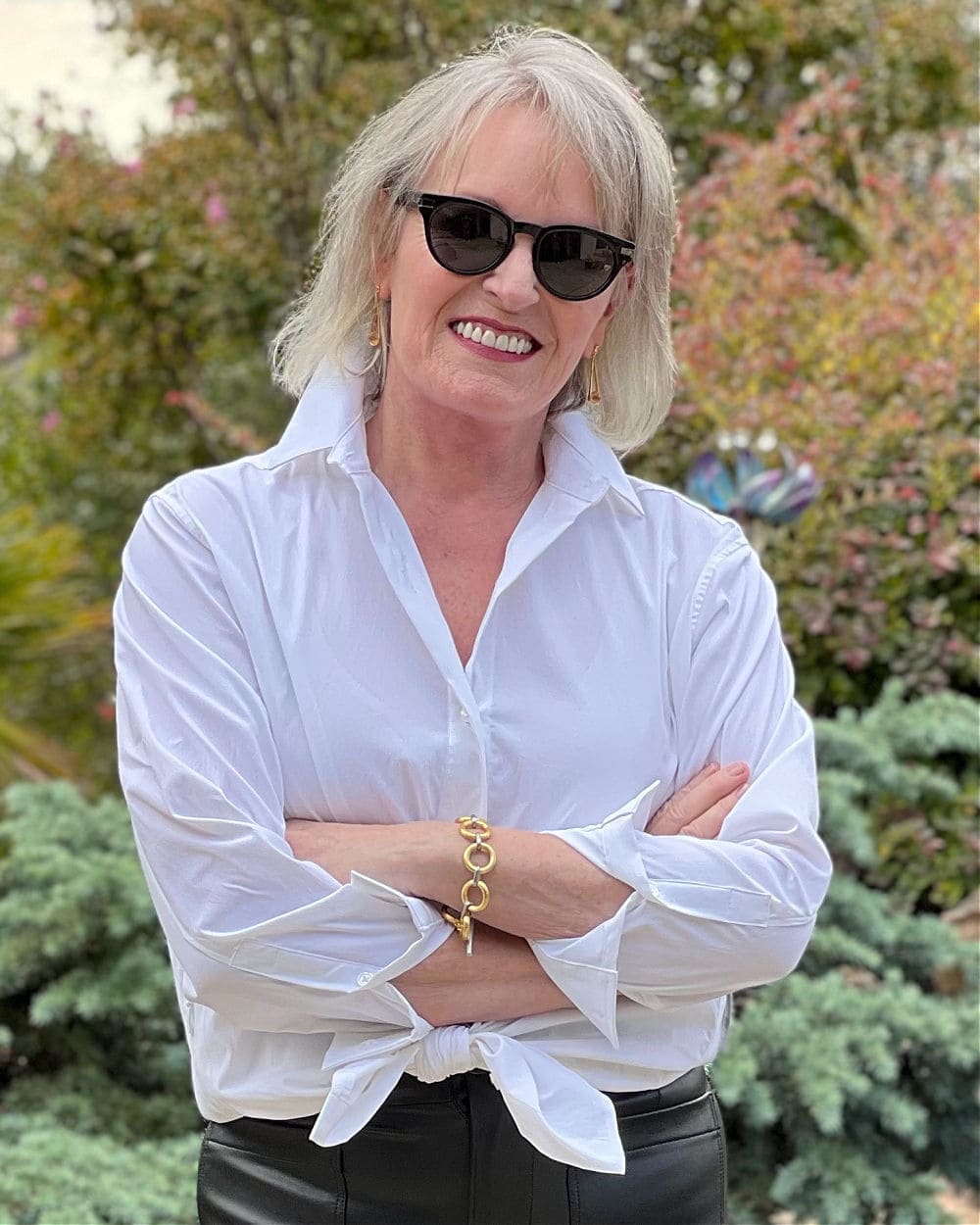 jennifer connolly of a well styled life wearing white athleta poplin shirt with dean davidson earrings and bracelet