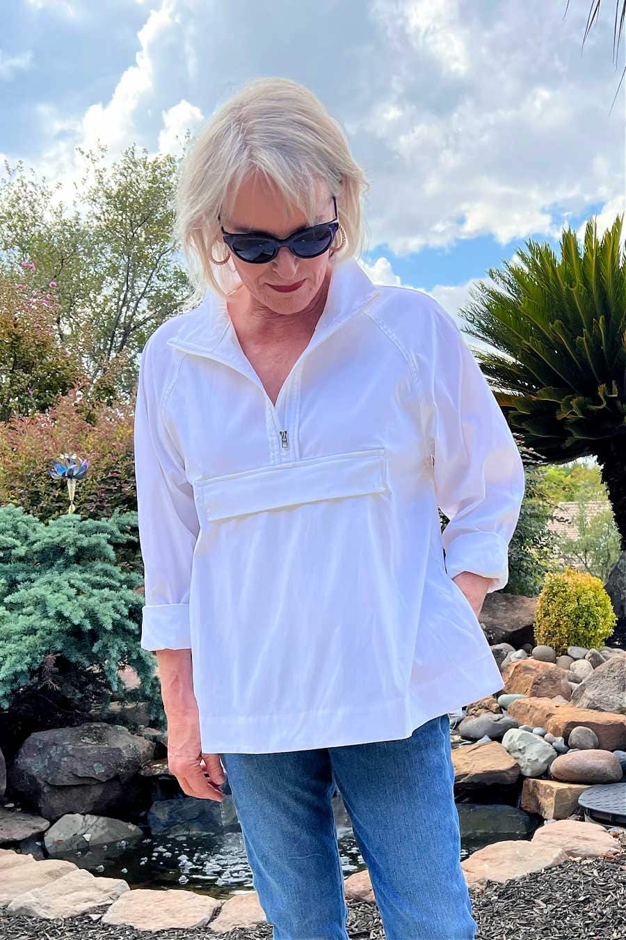 woman wearing white shirt and sunglasses