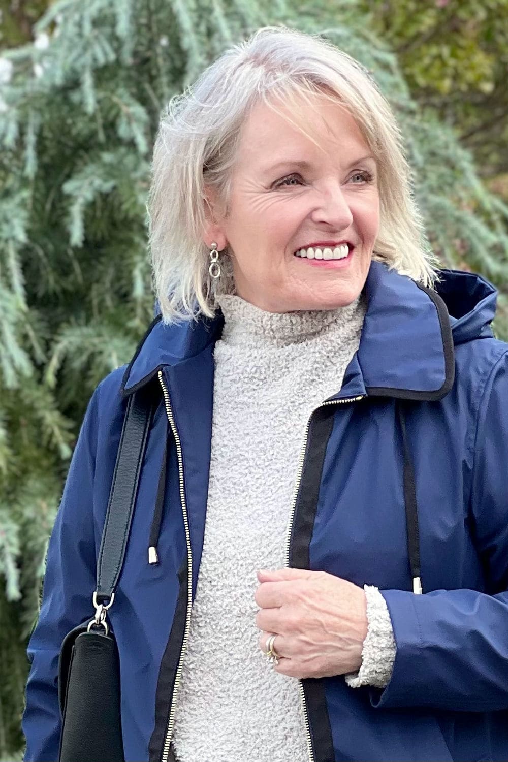 jennifer connolly of a well styled life wearing lois hill earrings and navy kate spade jacket