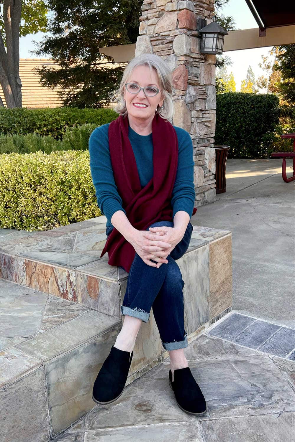 woman wearing cashmere sweater and jeans