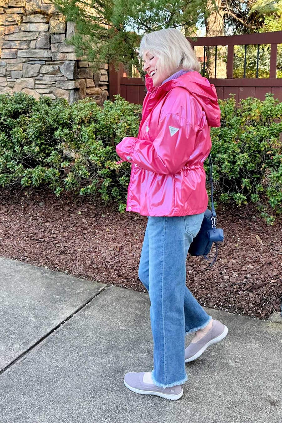 woman. wearing guess pink hooded raincoat
