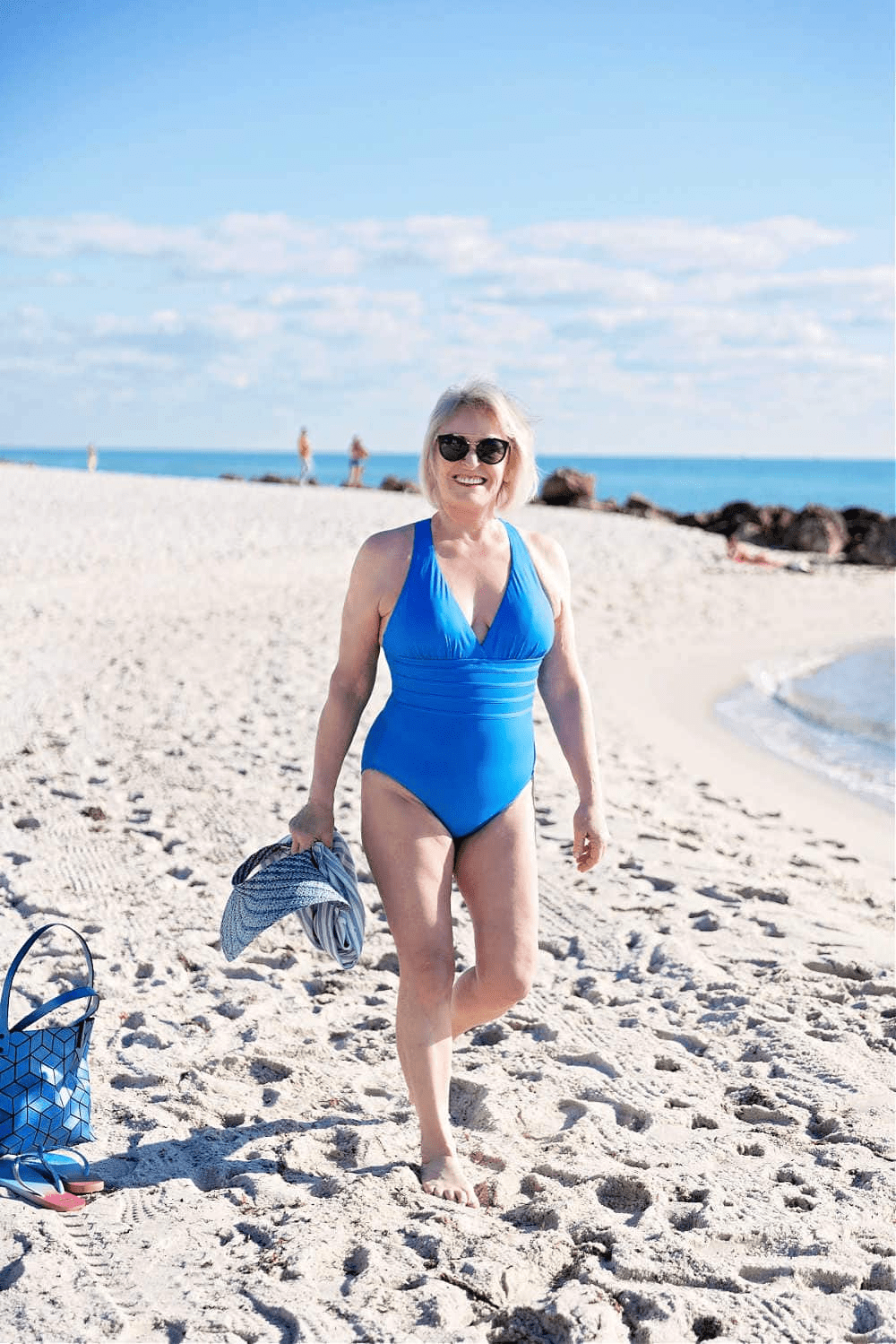 Jennifer wearing La Blanca cross-back suit