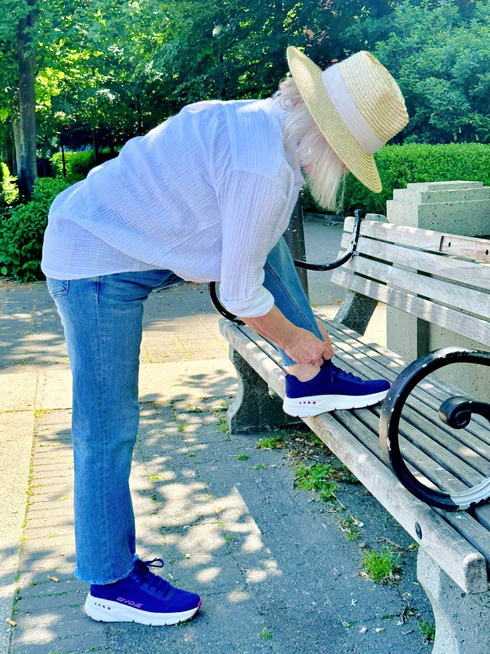older woman stretching to maintain flexiibility and her posture