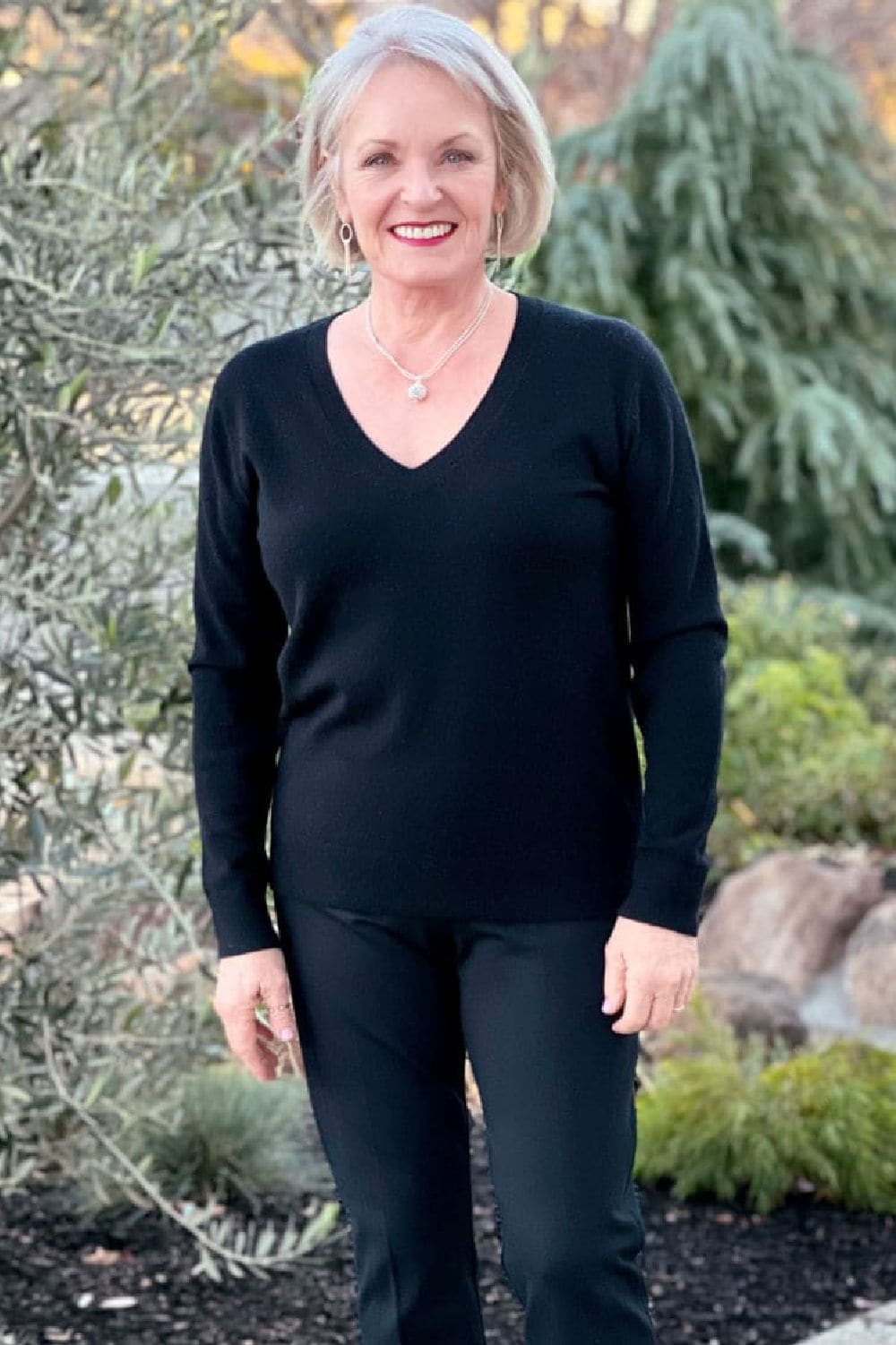 woman wearing black Vince luxury cashmere sweater