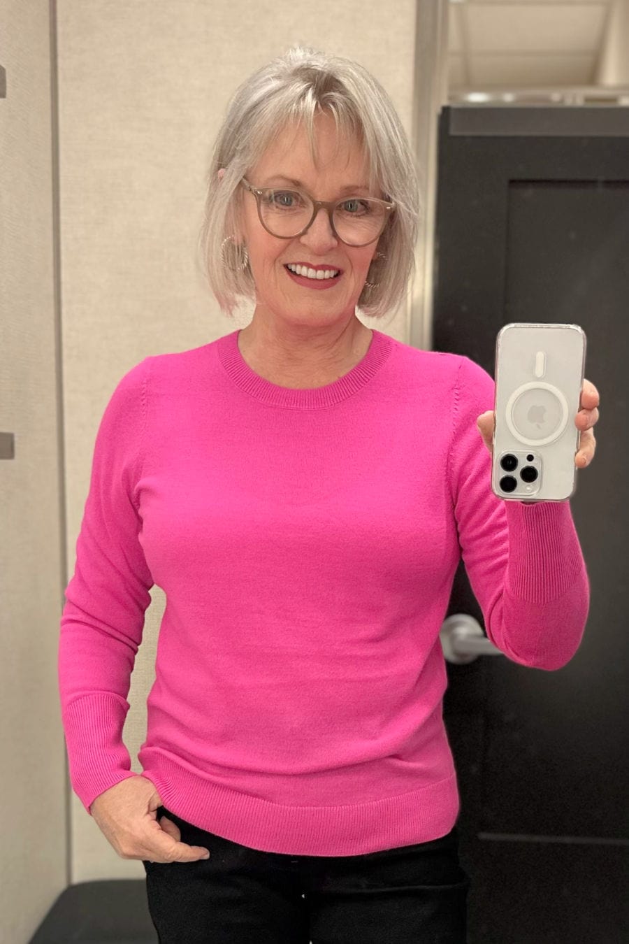 woman wearing bright pink Caslon sweater from Nordstrom