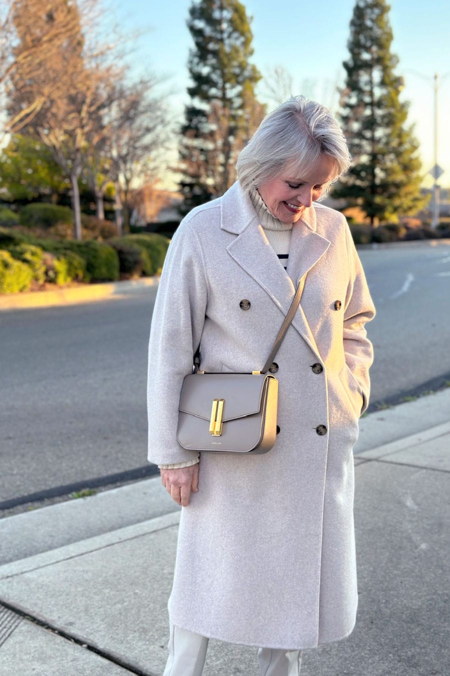 woman wearing neutral outfit which looks elegant
