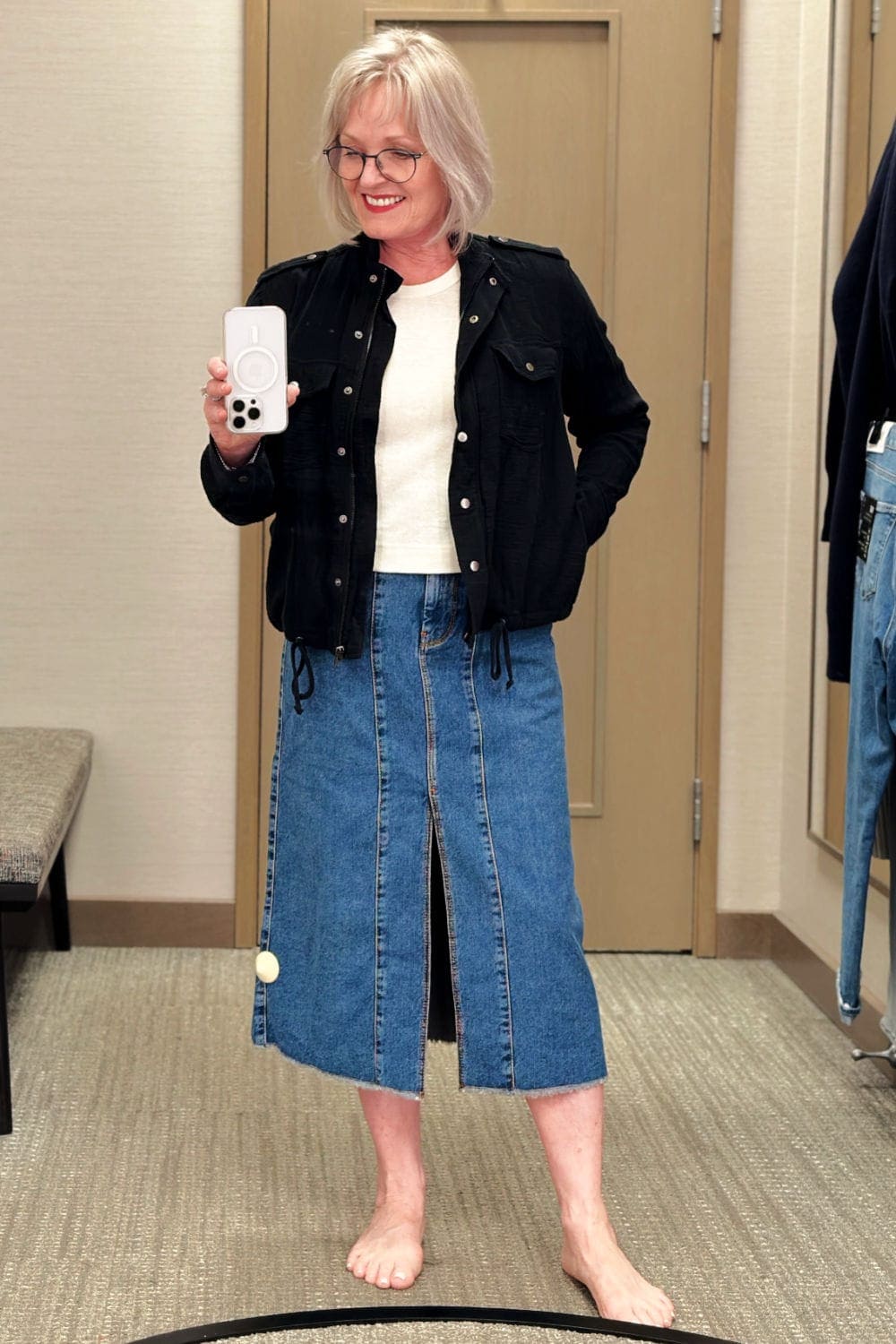 dressing room selfie of mid denim skirt on blogger jennifer connolly of a well styled life