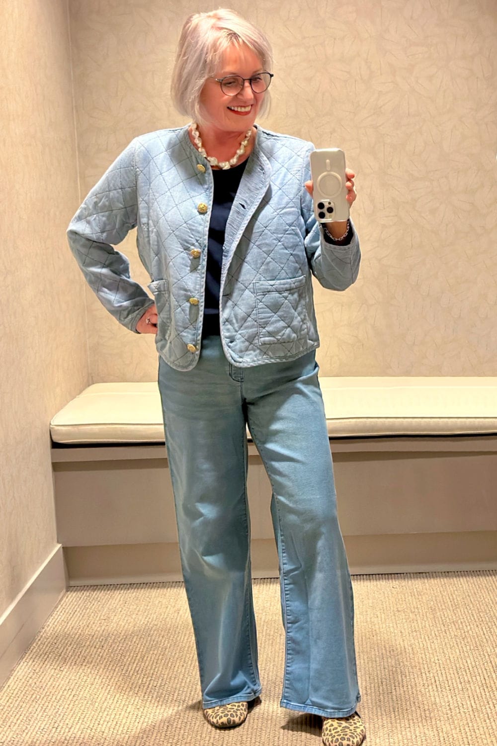 woman wearing j jill quilted denim jacket over wide leg jeans