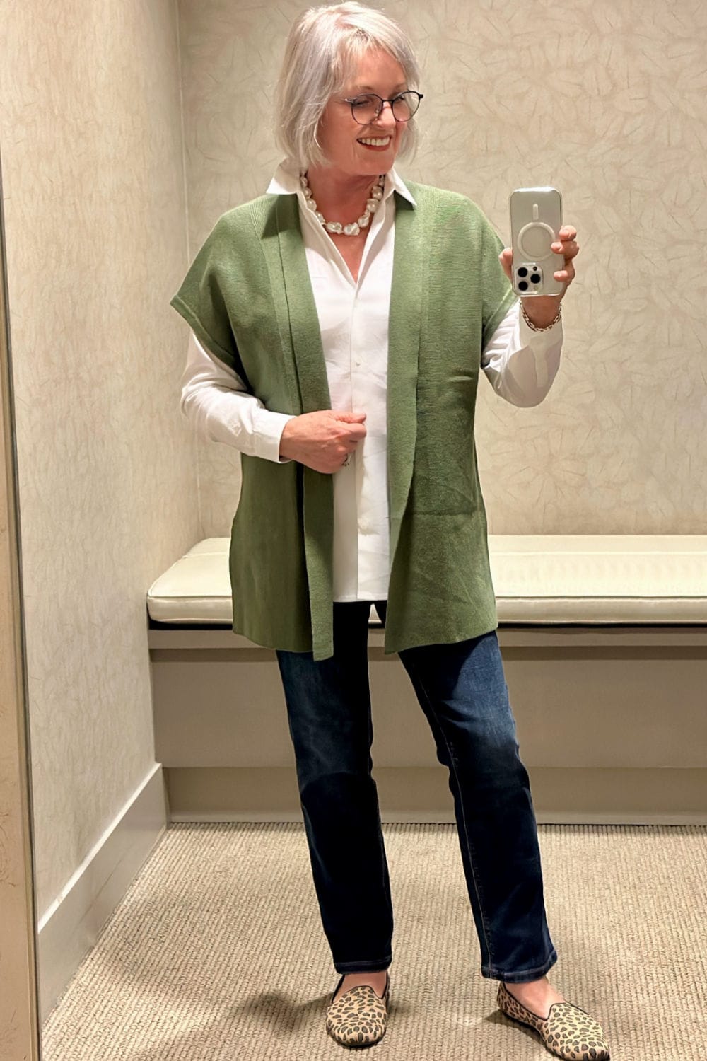 woman wearing white shirt and green gillet vest from J JILL