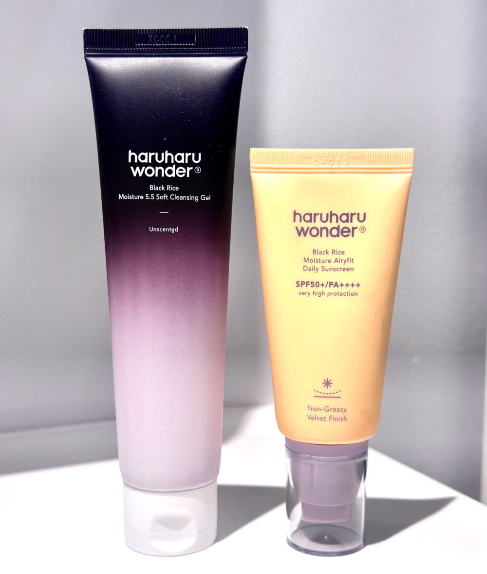 HARUHARU BLACK RICE CLEANSING GELL AND BLACK RICE SUNSCREEN TUBES ON BATHROOM COUNTER