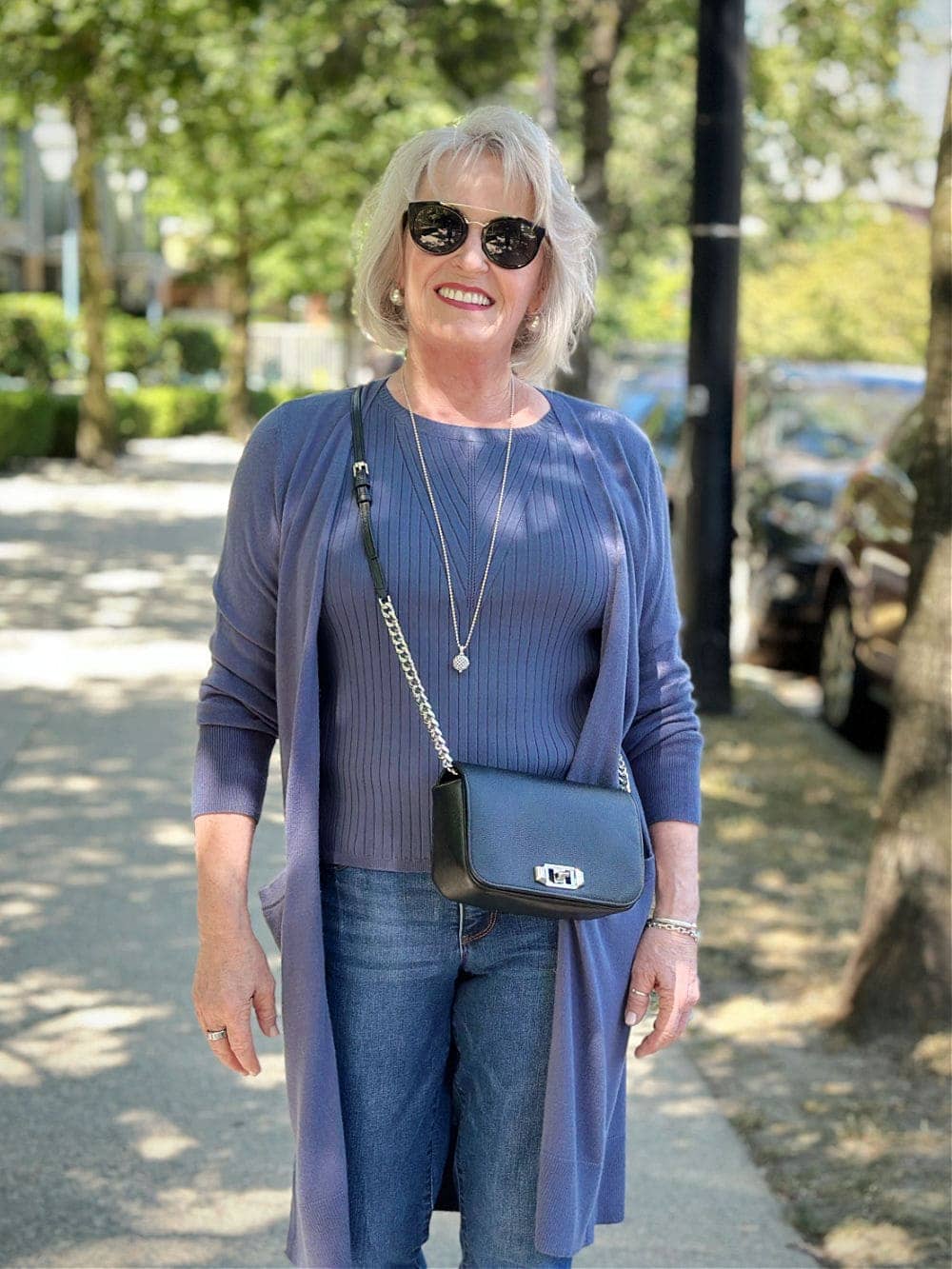 older woman wearing blue outfit with jeans