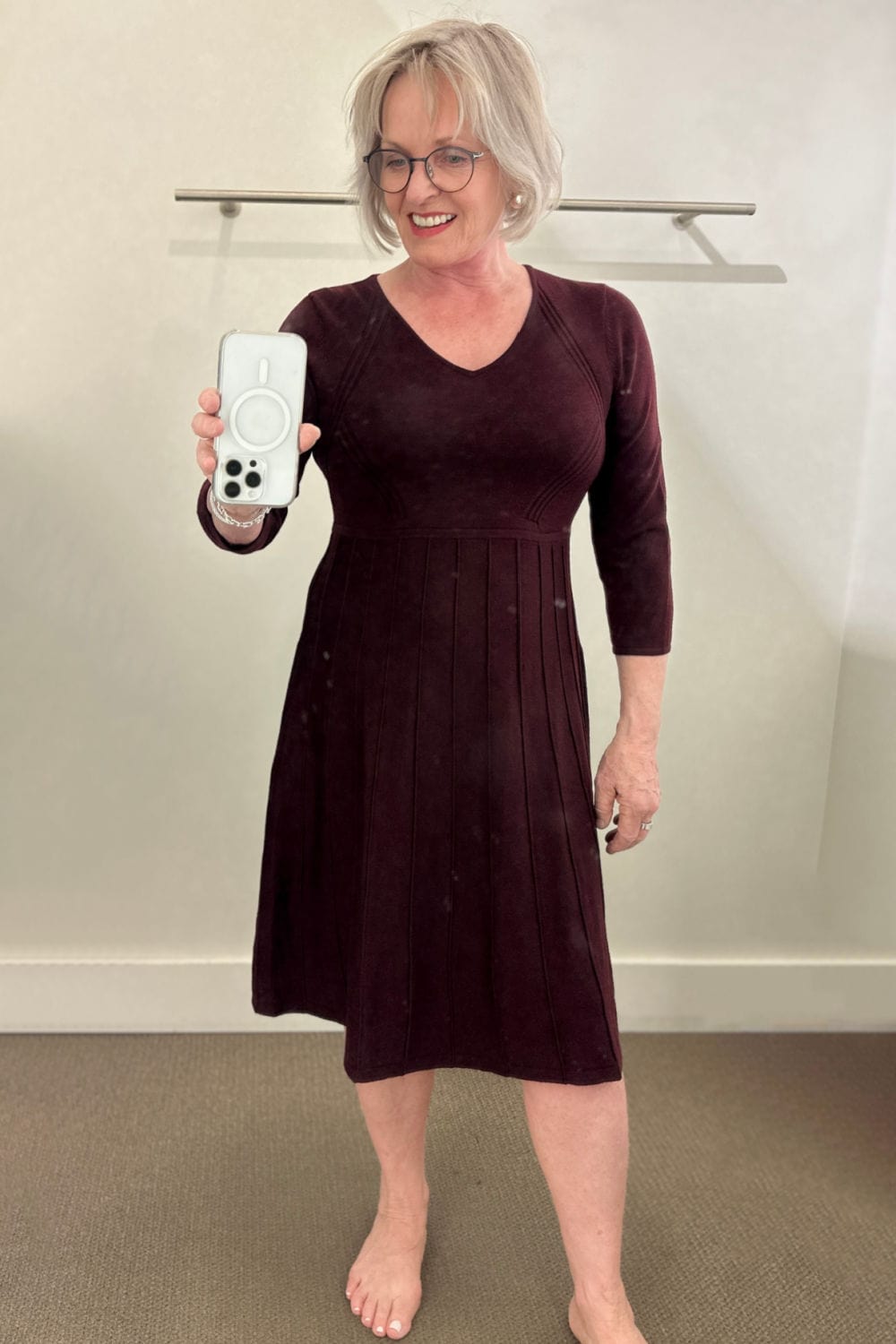 silvern haired woman wearing burgundy fit and flare dress from talbots